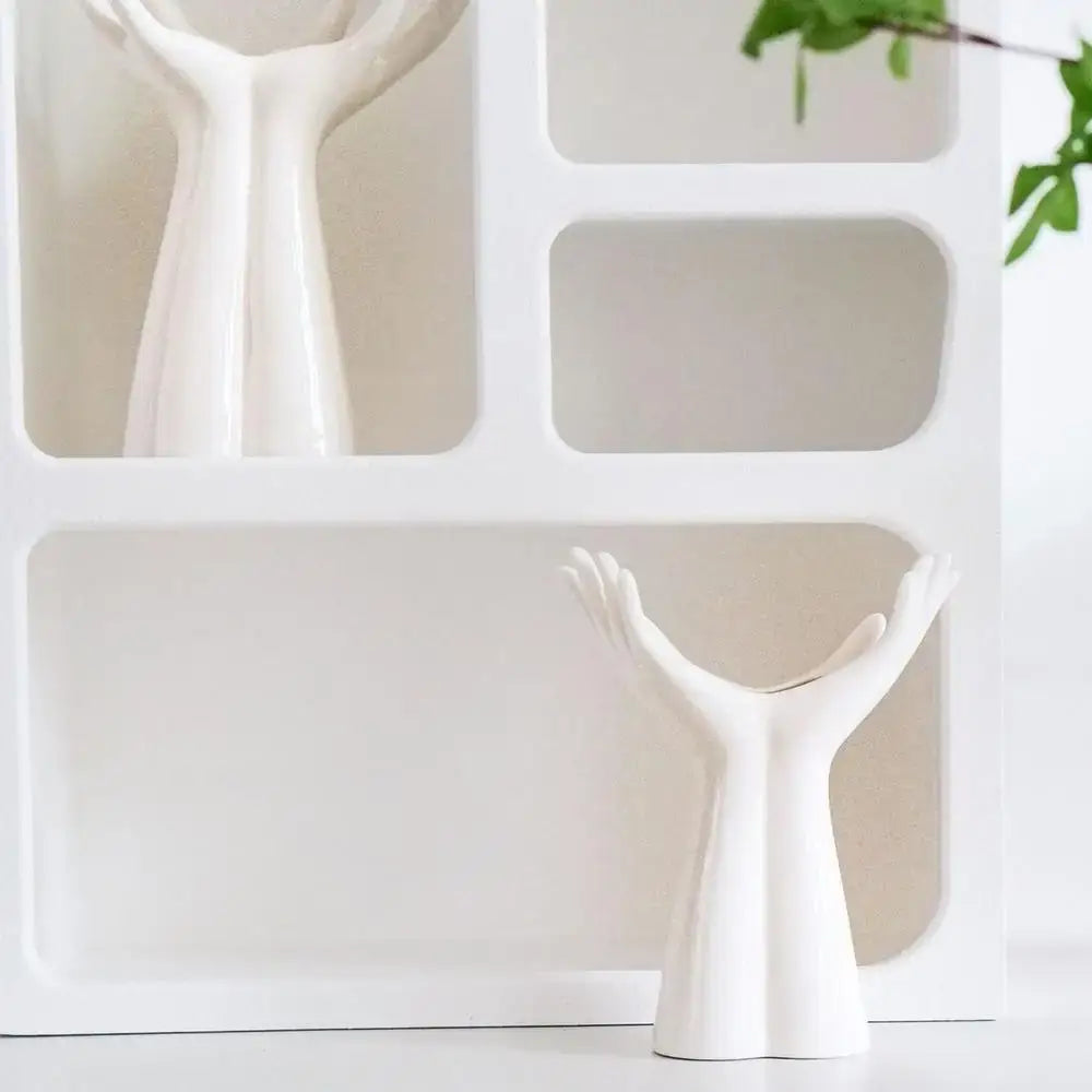 DecorBites™ sleek white ceramic flower vase shaped like a human hand for stylish home decor display