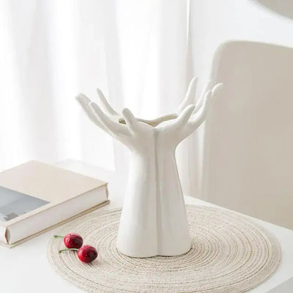 White ceramic DecorBites™ hand shaped porcelain flower vase resembling clasped human hands for elegant home decor