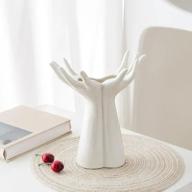 White ceramic DecorBites™ hand shaped porcelain flower vase resembling clasped human hands for elegant home decor