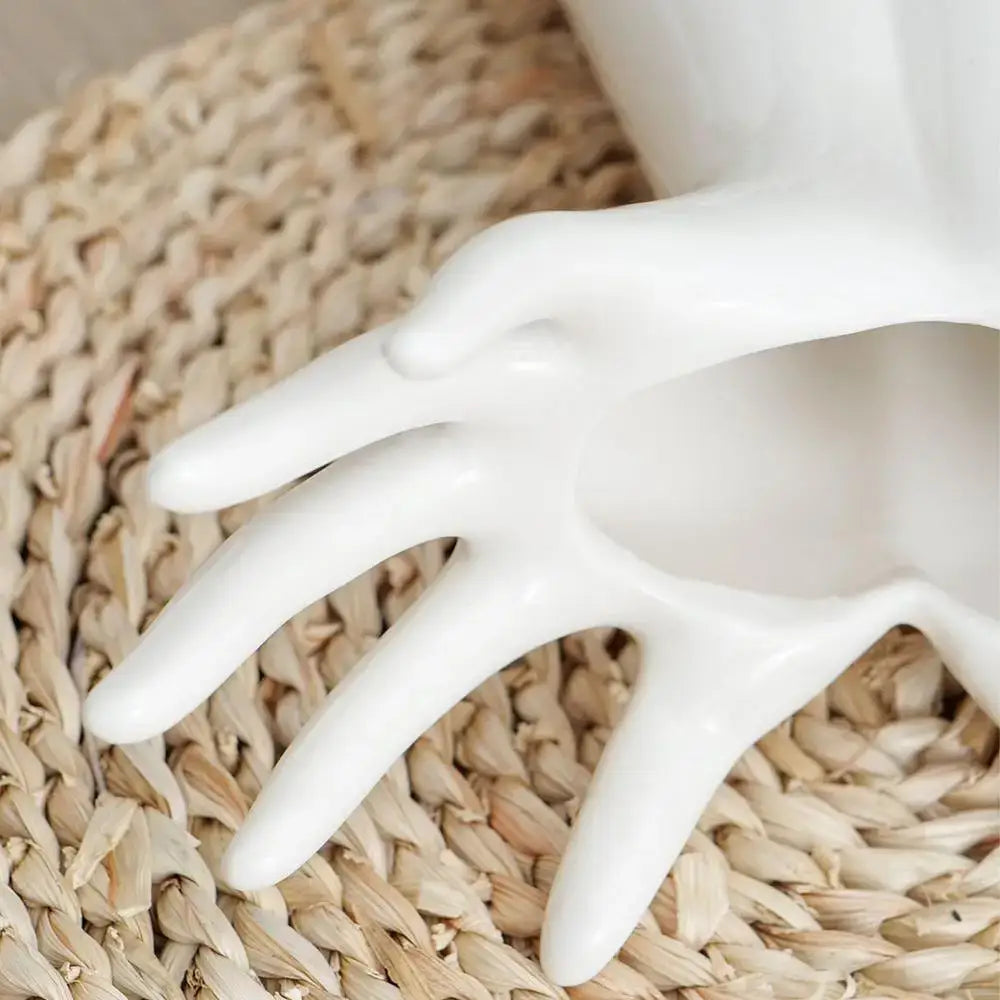 White ceramic hand shaped porcelain flower vase with smooth glossy finish for home decor and human hand vase use