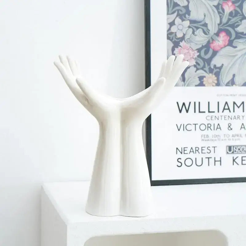 White ceramic hand shaped porcelain flower vase by DecorBites™ serving as elegant home decor and human hand vase