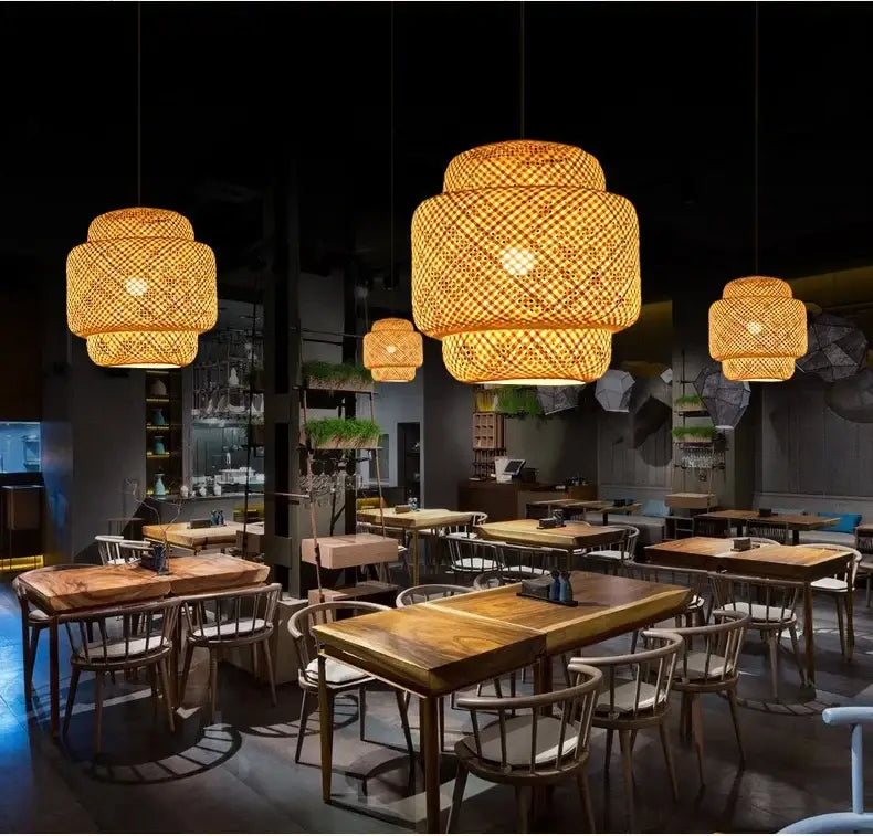 Warm tiered pendant light chandelier with hand-woven bamboo construction by decorbites hanging from ceiling