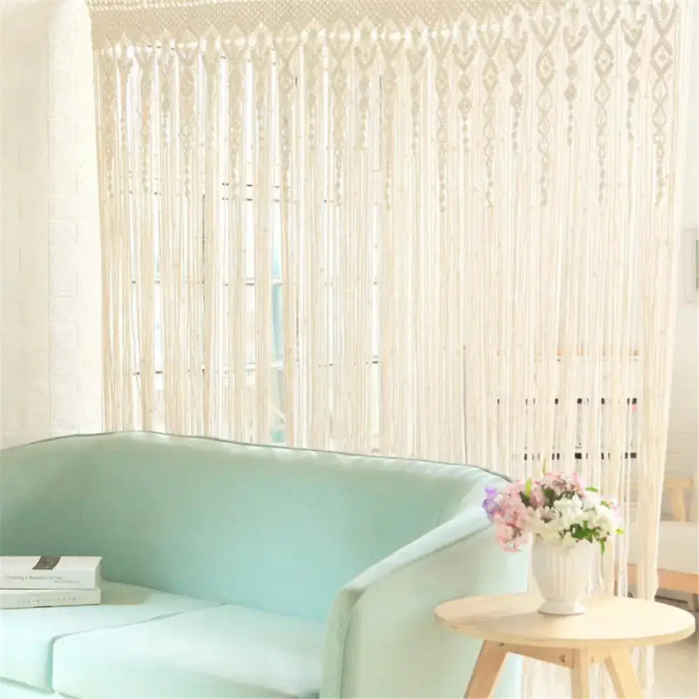 Cream-colored hand-woven macrame door curtain with intricate patterns and tassels for home doorway decor