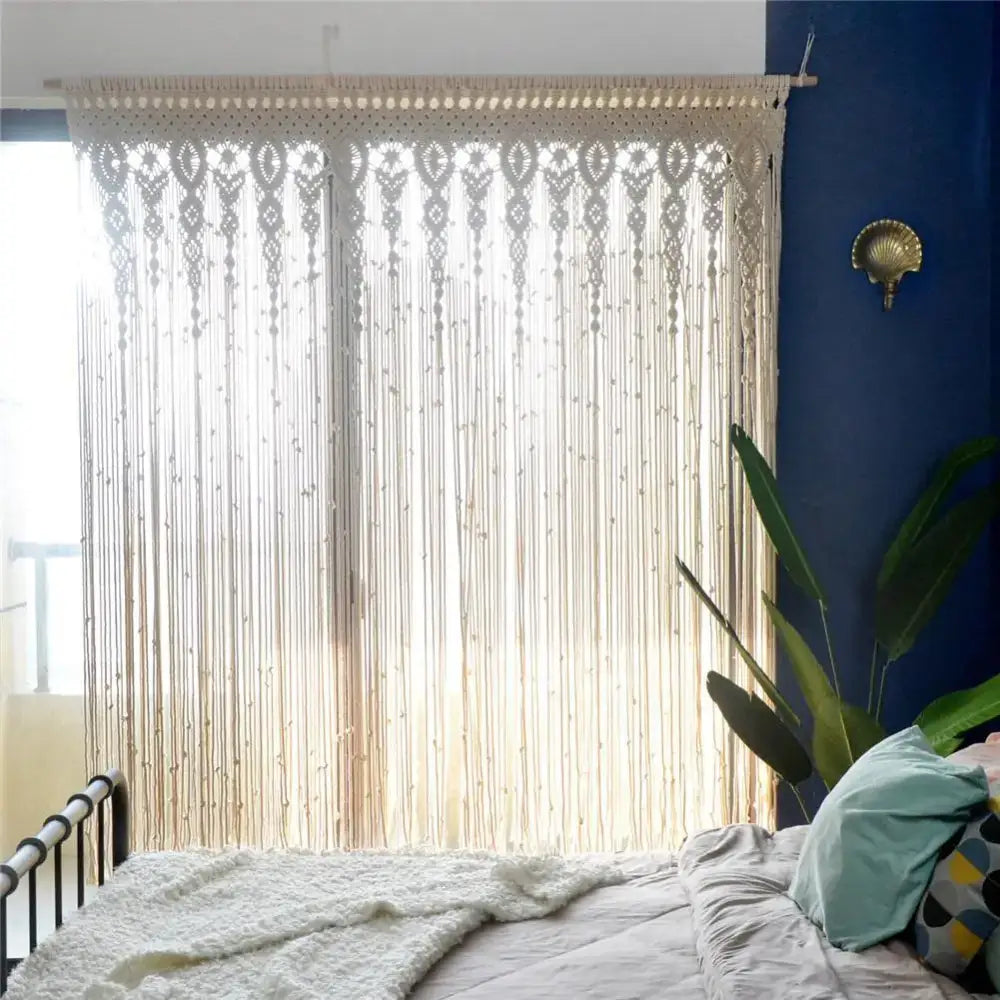 Cream-colored hand-woven macrame door curtain with intricate geometric patterns and fringe for home decor