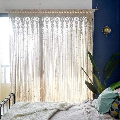 Cream-colored hand-woven macrame door curtain with intricate geometric patterns and fringe for home decor