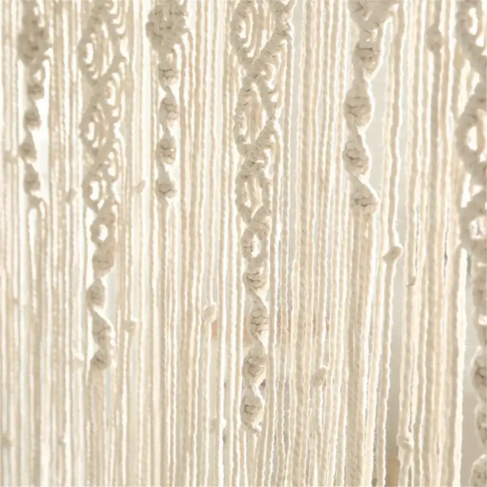 Cream-colored decorbites™ hand-woven macrame door curtain with intricate patterns and hanging tassels for home decor