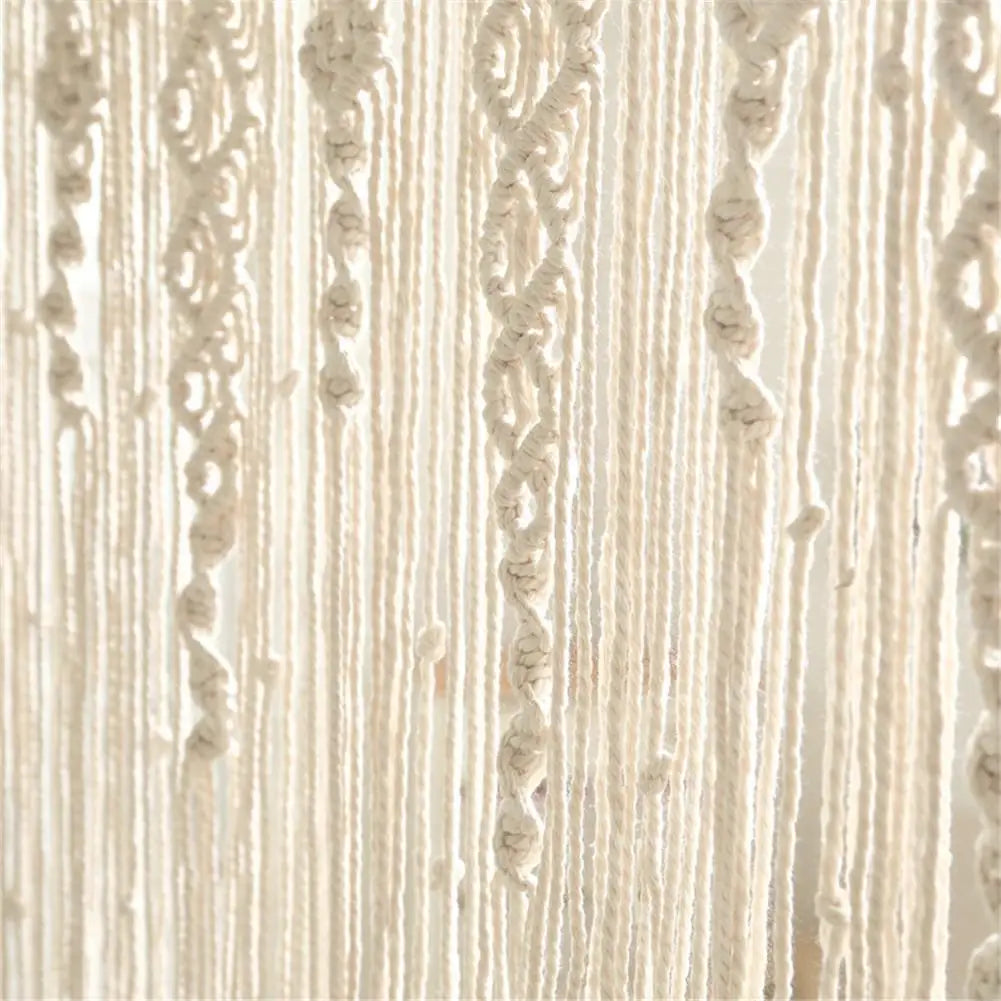 Cream-colored decorbites™ hand-woven macrame door curtain with intricate patterns and hanging tassels for home decor