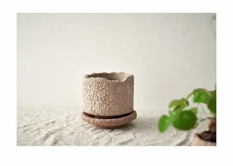 Rustic beige handcrafted ceramic vase with textured speckled surface and matching saucer for flowers by DecorBites™