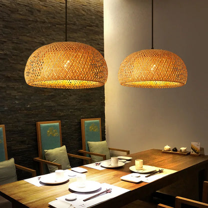 Warm-toned handcrafted DecorBites™ bamboo pendant lamps with dome shape hanging above dining table