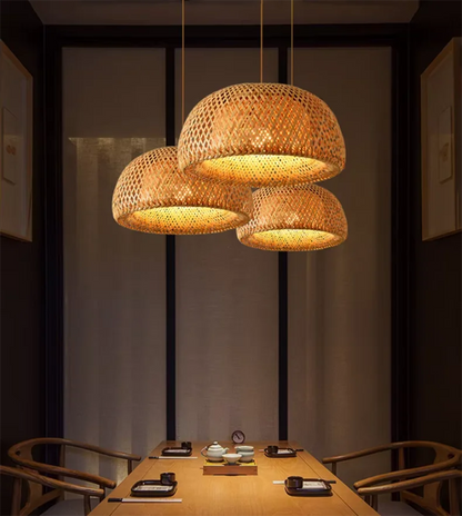 DecorBites handcrafted warm-toned bamboo pendant lamp with three woven lights in a modern dining space