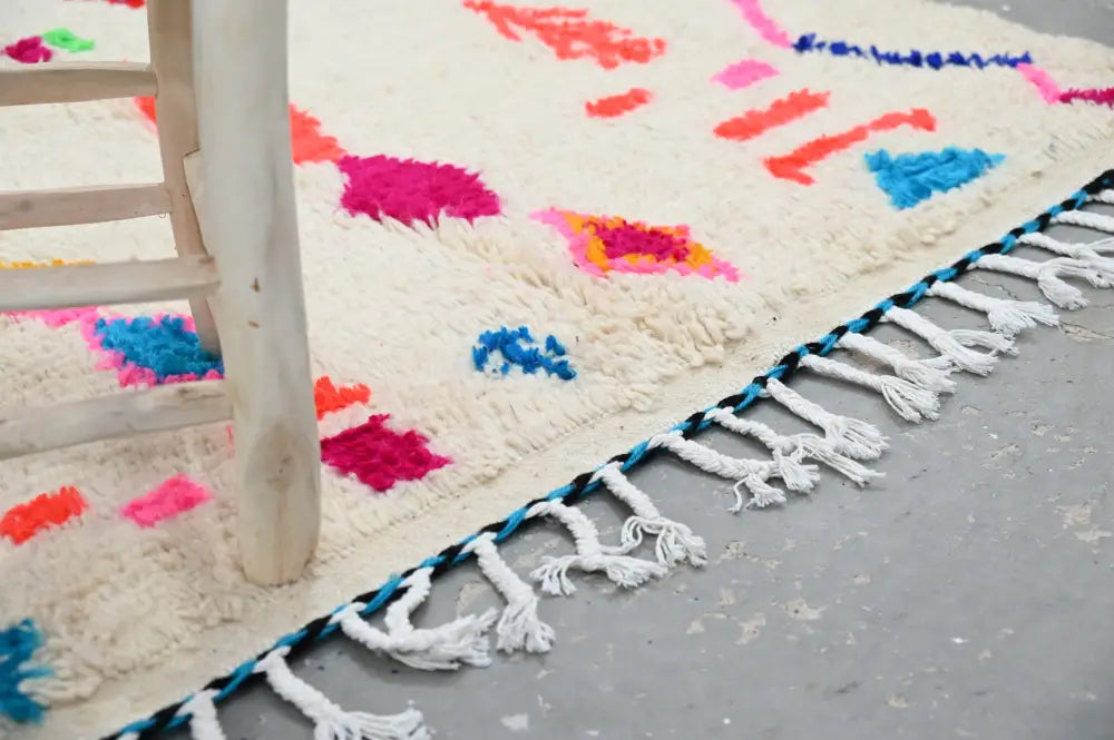 Decorbites™ handcrafted moroccan azilal rug 246 x 146 cm with vibrant cream base and bold pink blue orange geometric patterns