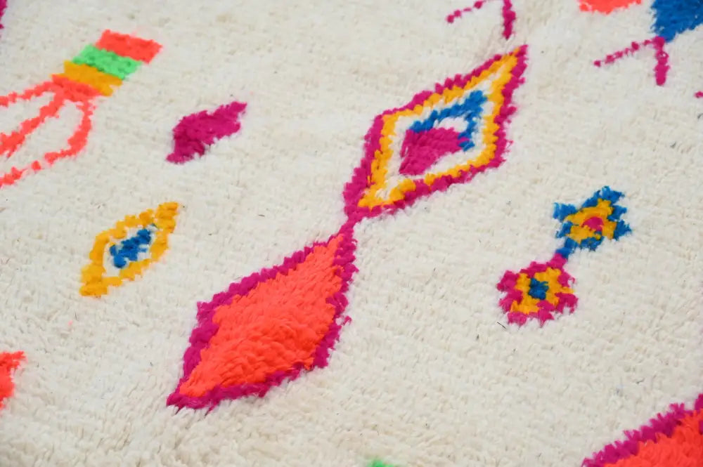 Vibrant handcrafted moroccan azilal rug with plush off-white base and neon geometric accents 246 x 146 cm