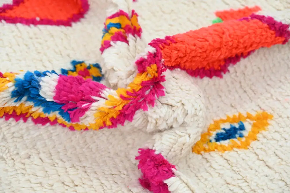 Decorbites™ handcrafted moroccan azilal rug with plush white base and neon geometric patterns in orange magenta yellow and blue