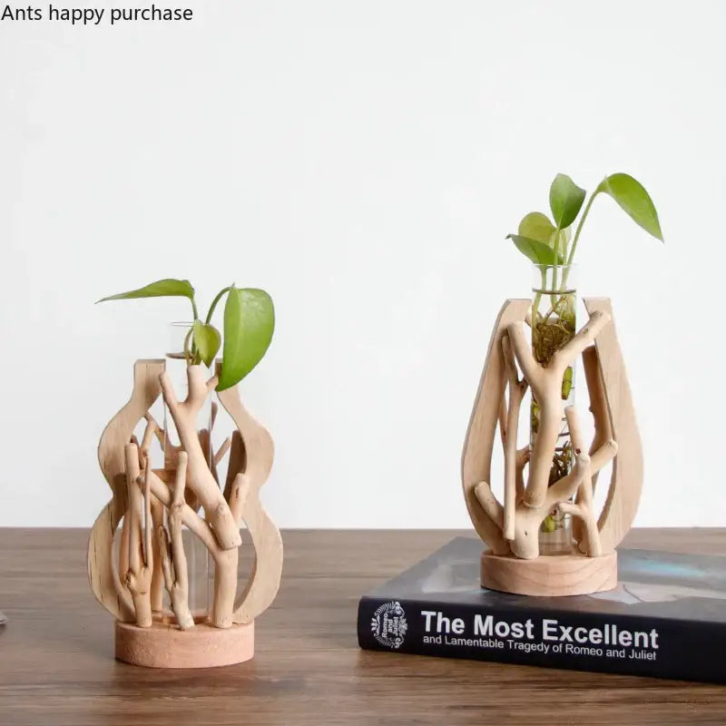 DecorBites™ handcrafted wooden vase featuring natural driftwood with clear glass insert and green plant for home decor