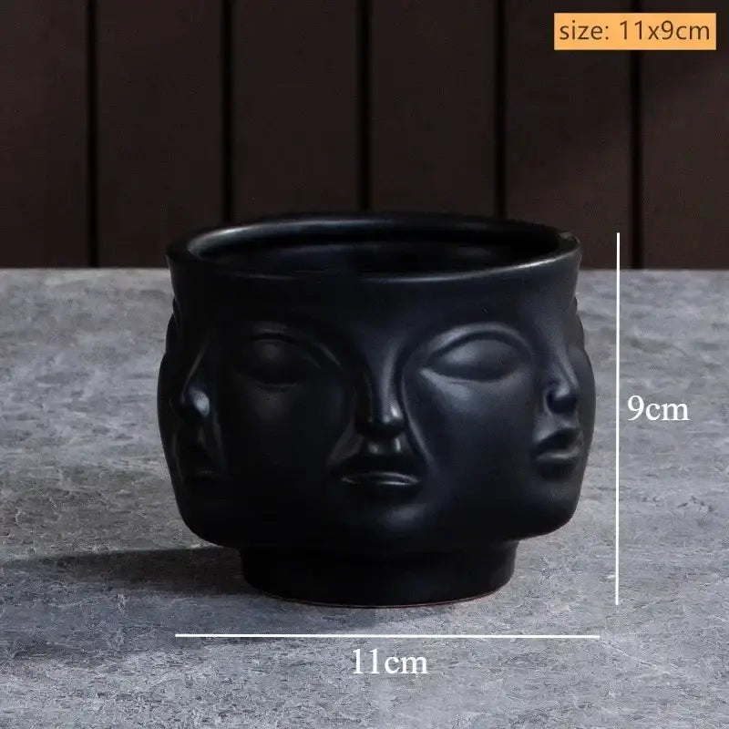 Black handmade ceramic face vase by DecorBites™ as an art vase sculpture for unique home decor display