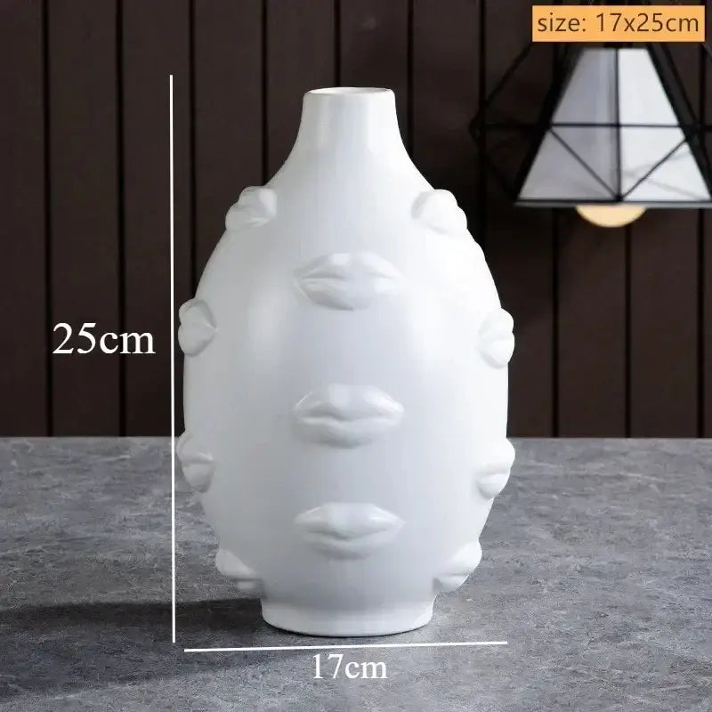 White ceramic handmade ceramic face vase with sculpted lips and rounded protrusions for home decor art vase sculpture