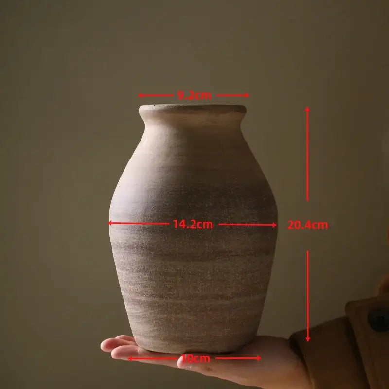 DecorBites™ handmade ceramic vase in rustic earth tones with textured surface and horizontal ridges for home decoration