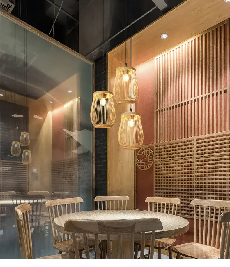 Three hanging pendant lights with woven bamboo shades and warm glowing bulbs in decorbites chinese rattan wicker pendant
