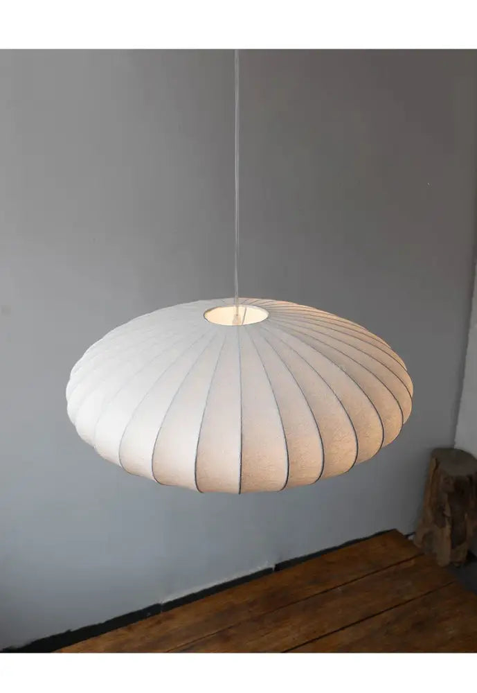 White ribbed paper pendant light with warm glow in a DecorBites™ japanese style silk chandelier design