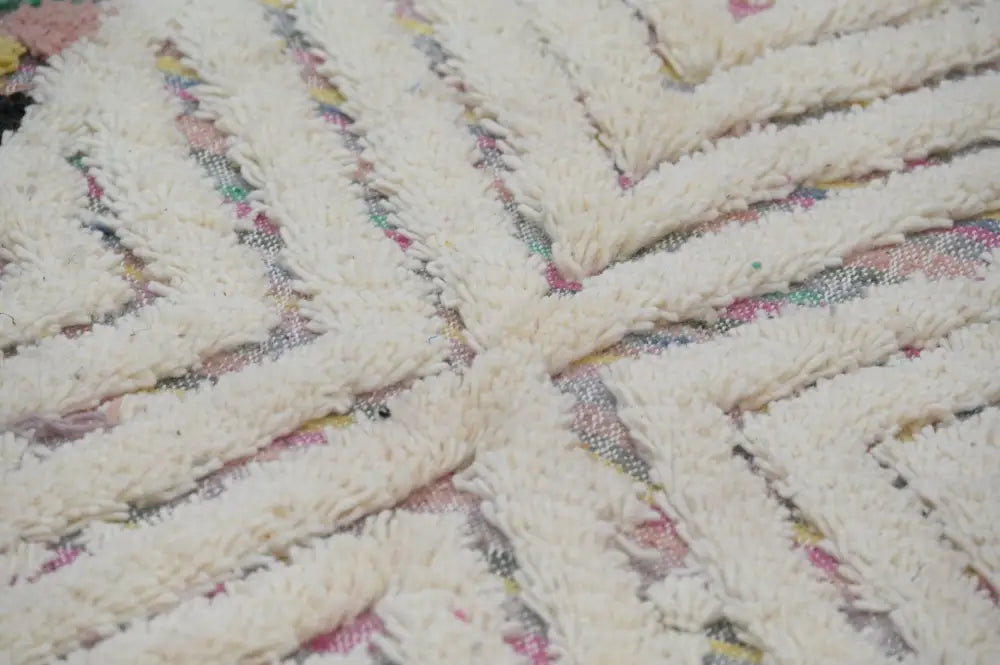 Cream-colored plush woven decorbites™ handmade Moroccan azilal rug 222x133 with textured braided pattern and multicolored accents