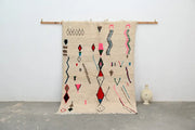 Beige moroccan handmade azilal rug in natural wool with colorful pink red blue and brown geometric patterns 223x157cm