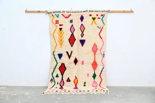 Beige moroccan handmade azilal rug with vibrant geometric patterns in natural wool by DecorBites 231x131cm