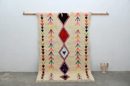 Beige DecorBites™ handmade moroccan azilal rug with bold red black blue and neon pink geometric patterns 231x152 cm
