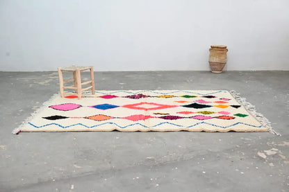 Beige cream handmade moroccan azilal rug with vibrant colors geometric patterns in pink blue orange and green 237x155 cm