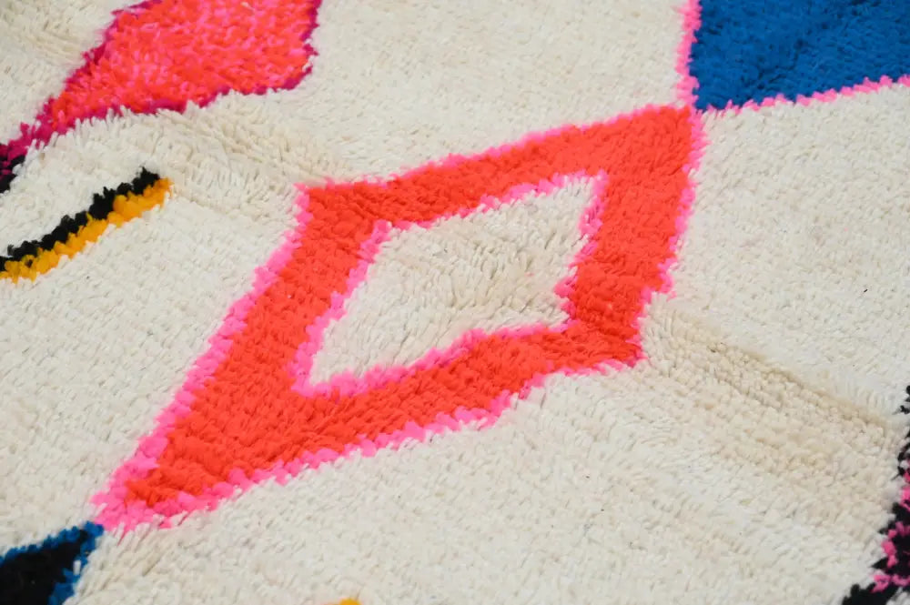 DecorBites™ handmade Moroccan azilal rug with vibrant colors and geometric wool pattern 237x155 cm cream background