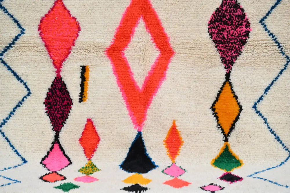 DecorBites™ handmade Moroccan Azilal rug with vibrant colors and geometric patterns on cream wool base 237x155 cm