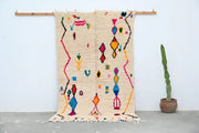 Beige handmade DecorBites™ azilal rug 240x132cm with colorful pink blue yellow and red geometric patterns