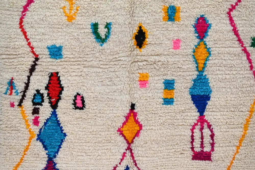 DecorBites™ handmade azilal rug 240x132cm with a cream base and vibrant multicolor geometric patterns