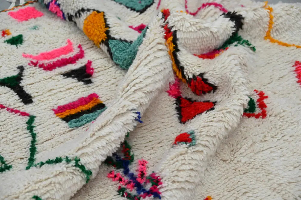DecorBites™ handmade traditional azilal rug 240x141 cm plush off-white with vibrant geometric patterns in pink orange green red and black