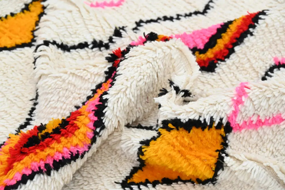 Vibrant DecorBites™ handmade azilal rug 240x150cm with natural wool fluffy white base and bold orange pink black accents