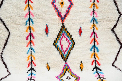 DecorBites™ handmade Moroccan Azilal rug with vibrant geometric pattern on cream base in pink blue orange and black
