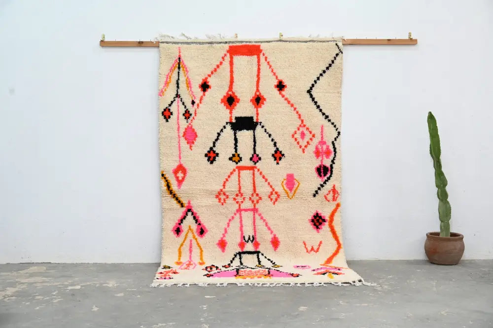 Beige handmade moroccan azilal rug with vibrant pink orange black and red geometric patterns 245x141cm decorbites™