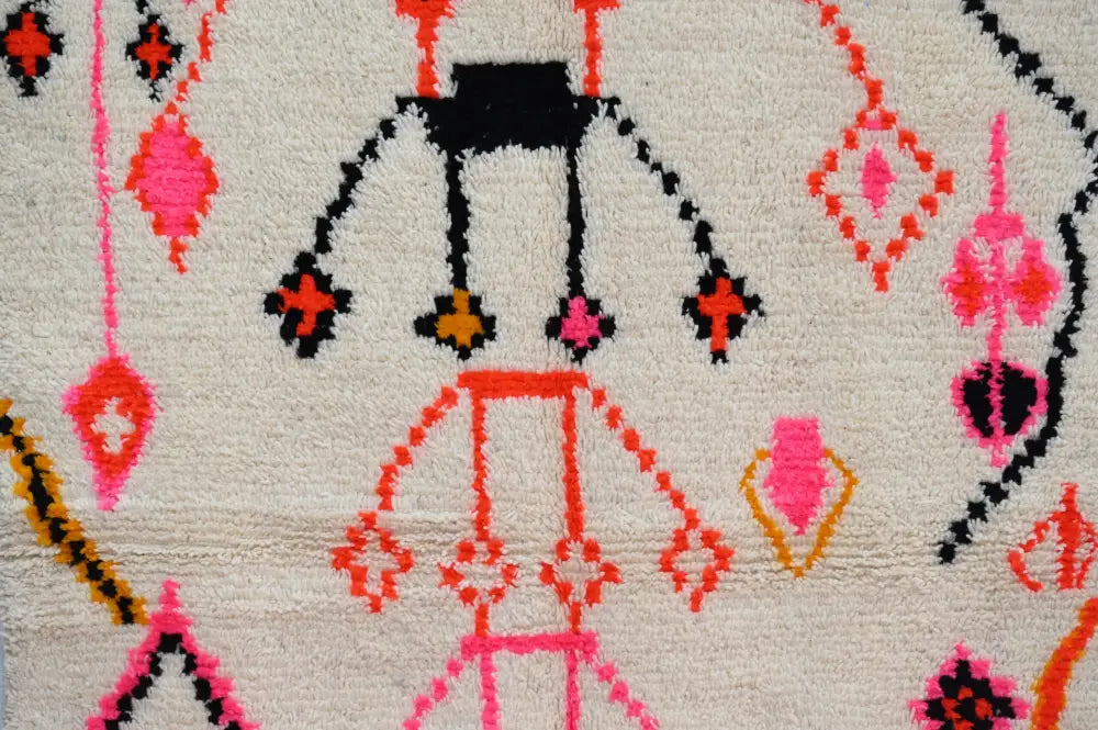 Cream-colored handmade Moroccan Azilal rug with bold black pink orange and yellow geometric patterns 245x141cm
