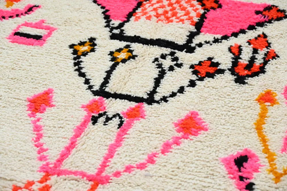 Decorbites™ handmade moroccan azilal rug featuring bold pink and orange floral motifs on a creamy off-white background