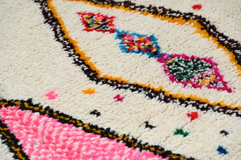 DecorBites™ handmade moroccan azilal rug 245x146 cm with a cream base and bold pink blue green red and black patterns