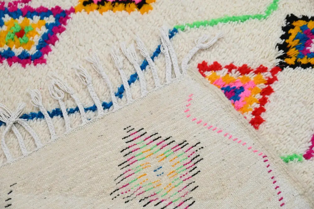 DecorBites™ handmade moroccan azilal rug with vibrant geometric patterns on a cream-colored base 246x142cm
