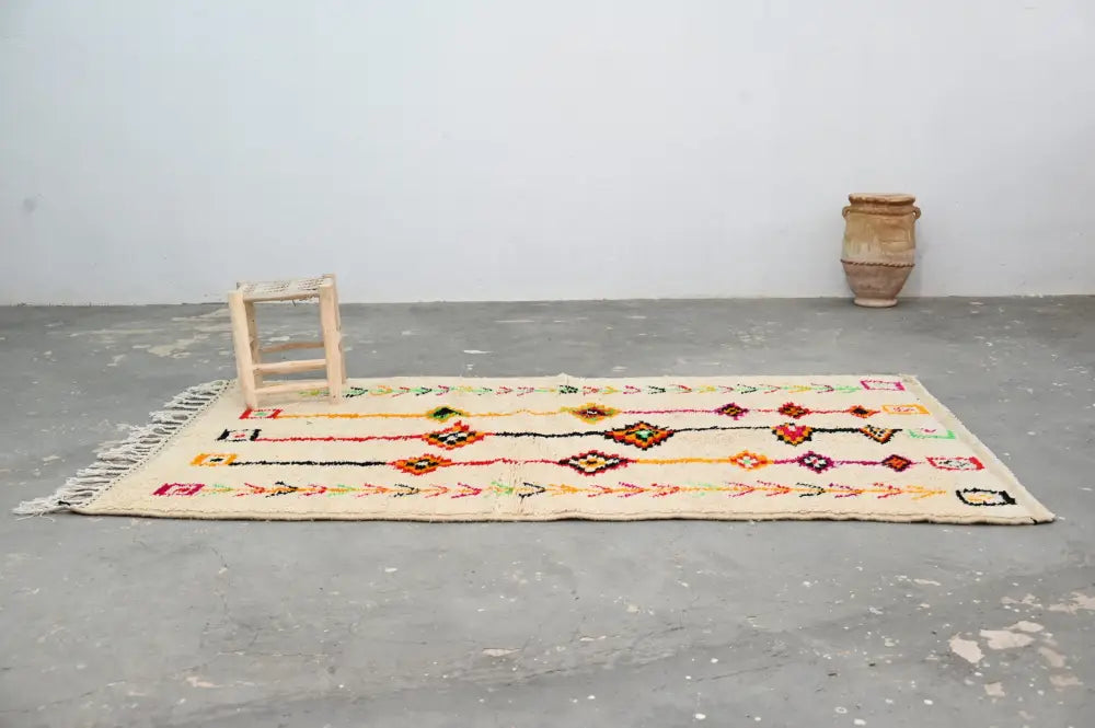 Beige handmade moroccan azilal rug with colorful geometric patterns and fringed edges by DecorBites™ 246x146 cm