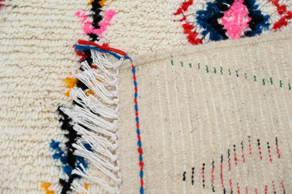 Beige decorbites™ moroccan handmade azilal rug with colorful fringe and embroidered geometric patterns in natural wool