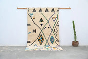 Beige handmade moroccan azilal rug with black green blue and orange geometric patterns 250x141 cm by decorbites