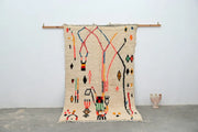 Beige moroccan azilal rug with colorful red blue orange and black geometric patterns handmade 250x154cm by DecorBites