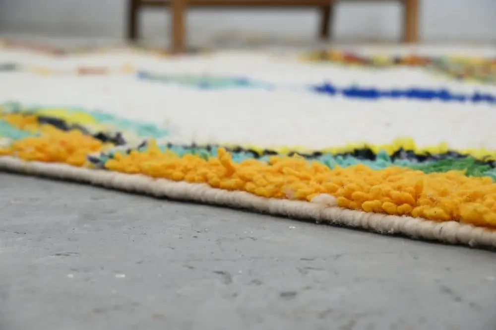 DecorBites handmade moroccan azilal rug with white base and bold yellow blue green black wool stripes 300 x 206 cm