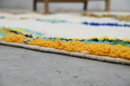 DecorBites handmade moroccan azilal rug with white base and bold yellow blue green black wool stripes 300 x 206 cm