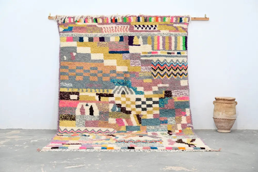 A vibrant moroccan handmade azilal rug with earthy tones and bright accents by decorbites 300x208 cm