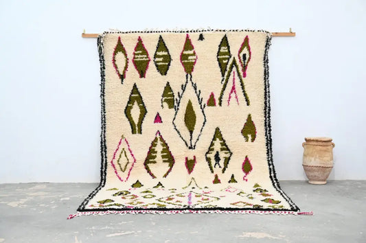 Beige handmade moroccan azilal rug with geometric olive green pink and black patterns and fringed edge 302x197 cm