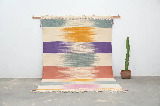 Colorful handmade moroccan azilal rug 302x197cm with horizontal stripes and textured fringed edges by decorbites