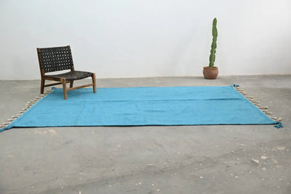 Bright turquoise woven decorbites handmade moroccan azilal rug 306x200cm with fringed edges and intricate texture